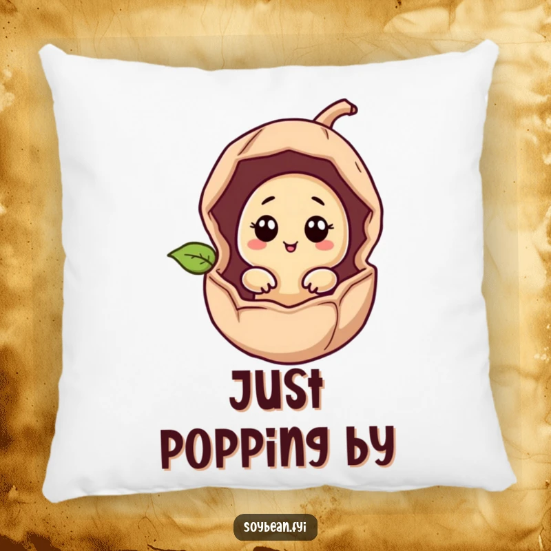 Funny giggling soybean character peeking from a bean pod on a soft, decorative pillow.
