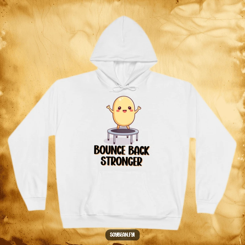 Funny Hoodie: A cheerful soybean energetically bouncing on a small trampoline, designed for maximum comfort and humor.