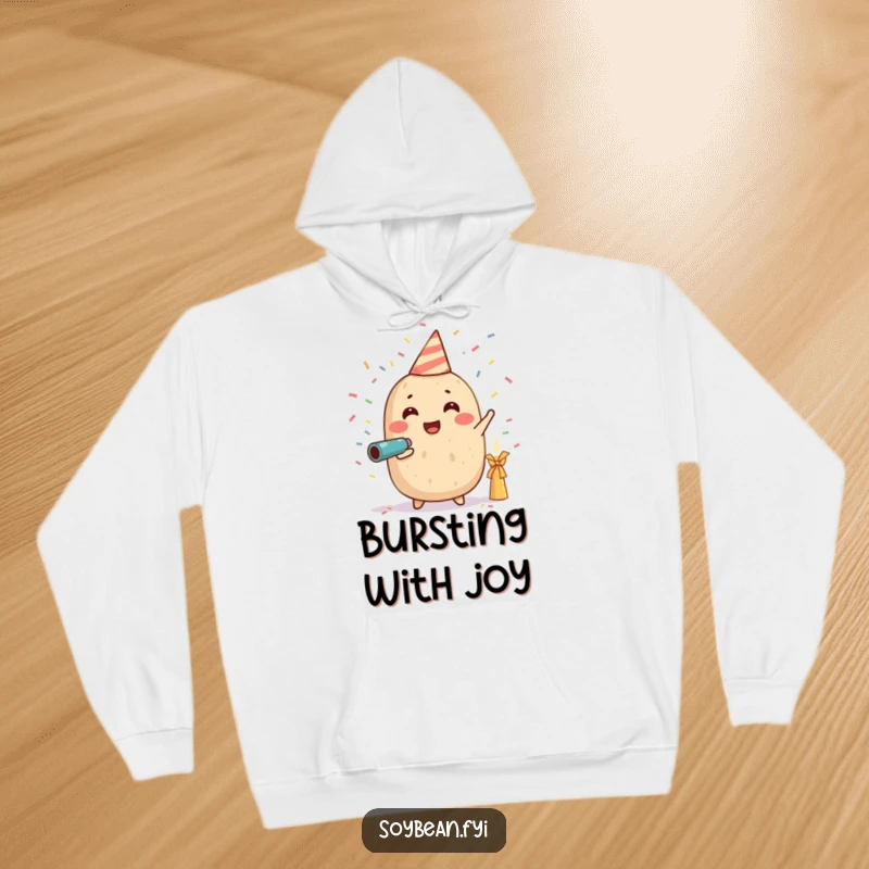 Funny hoodie featuring a gleeful soybean character launching a shower of confetti from a miniature cannon, embodying pure celebration and humor.