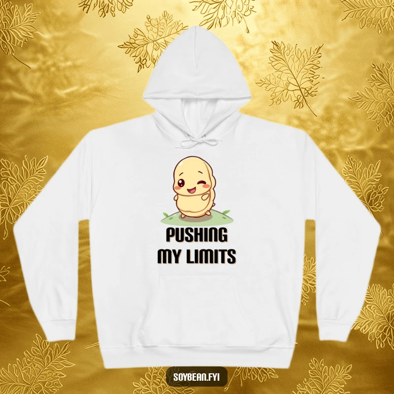 Funny hoodie depicting a happy soybean with a determined expression, in the process of rolling uphill.