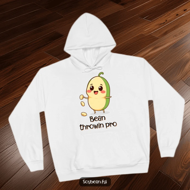 Funny Kawaii soybean character hoodie, beaming with a smile while tossing a tiny bean, radiating warmth and amusement.
