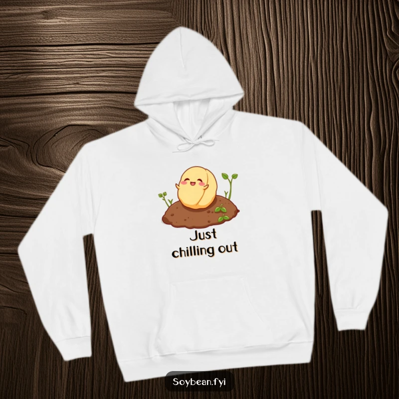 Funny playful soybean rolling joyfully on soil depicted on a cozy hoodie.