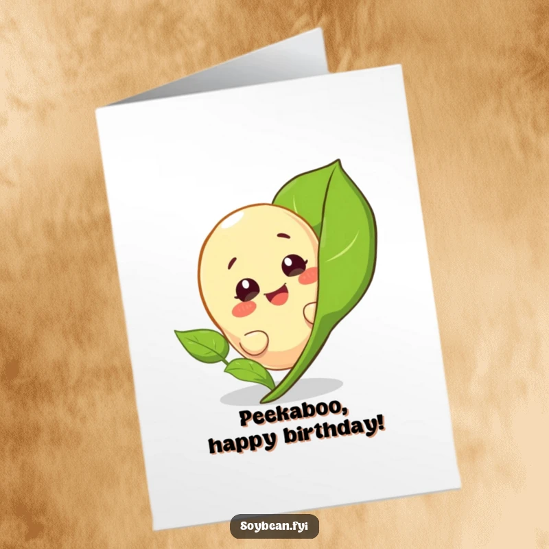 Funny Free Printable Happy Birthday Card with a giggling soybean character playfully peeking from behind a large green leaf.